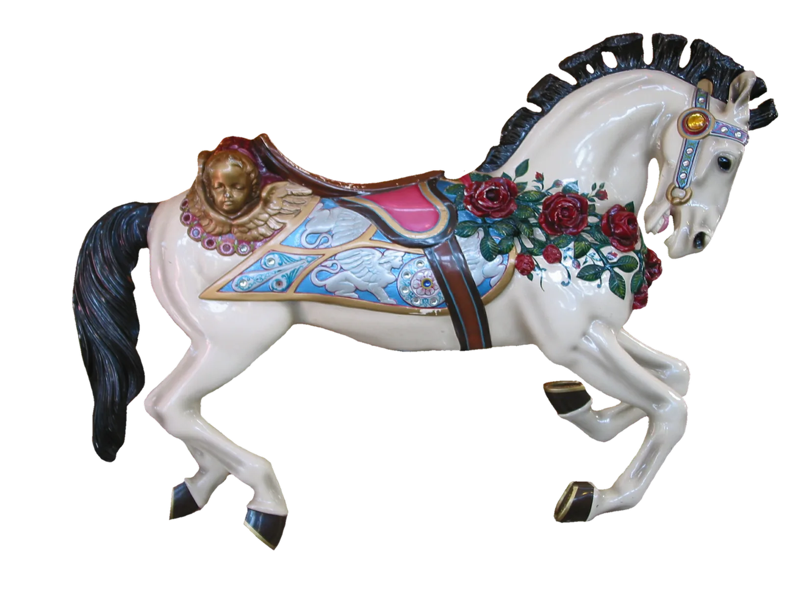 Jessie's Critter Carousel: An ornate white carousel horse decorated with red roses and blue saddle details isolated against a black background.