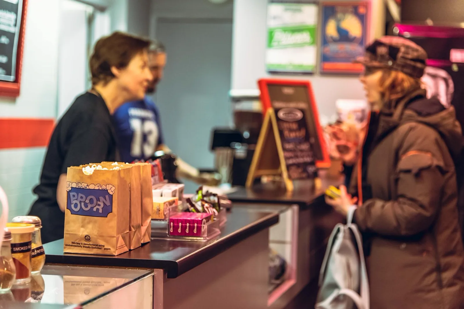 Market Restaurant: Bags of fresh popcorn sit on a service counter in front of staff and customers.