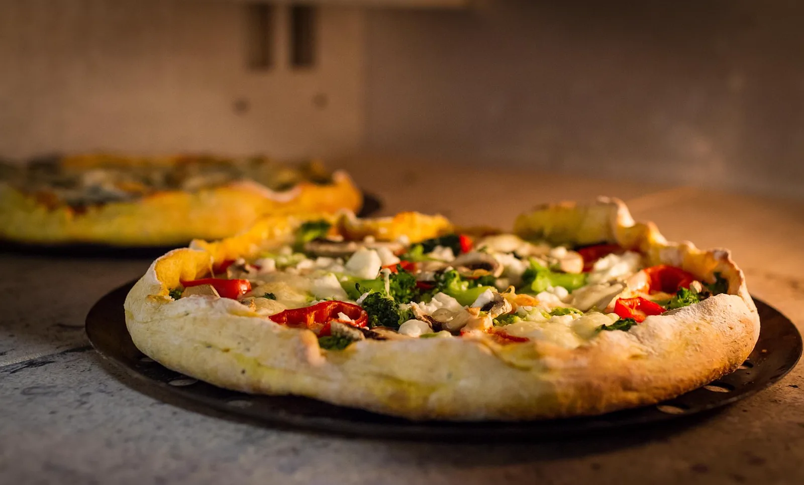 Miss Rabbit's Diner: A freshly baked vegetable pizza sits inside a warm oven.