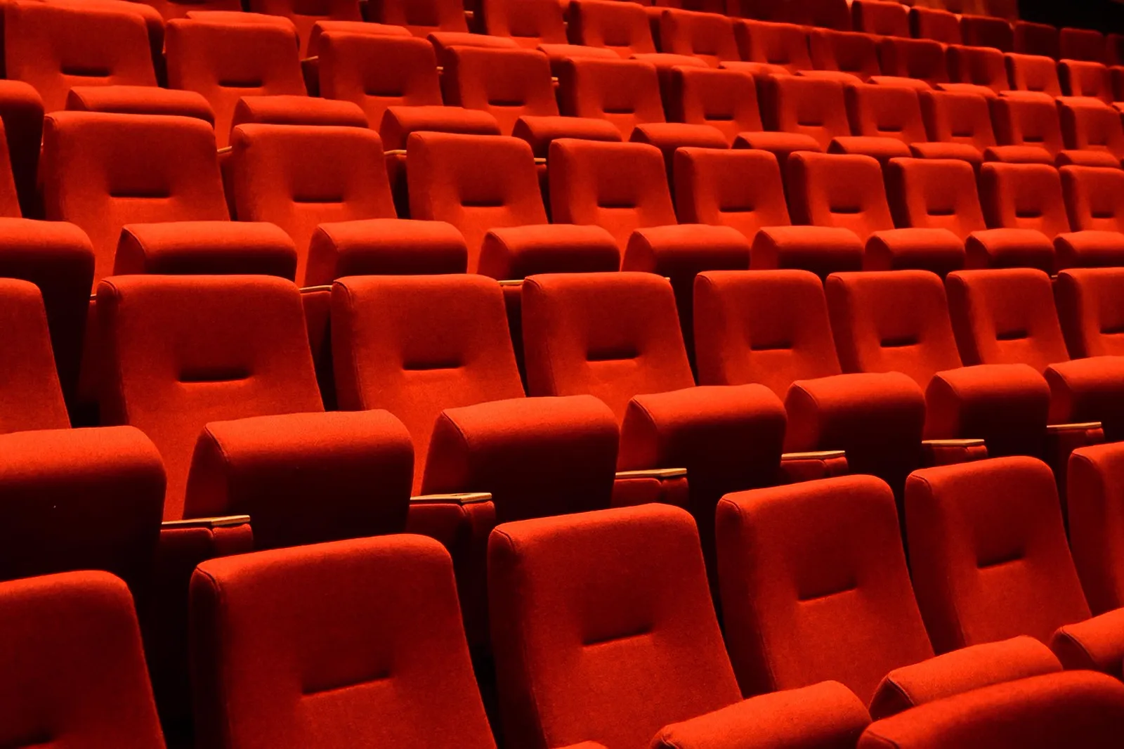 Shuttle Launch Experience: Rows of red theater seats.